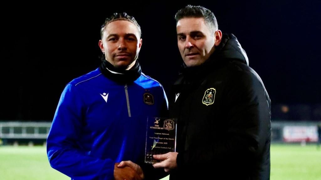 Dumbarton striker Leighton McIntosh is presented with his Player of the Month award by manager Frank McKeown