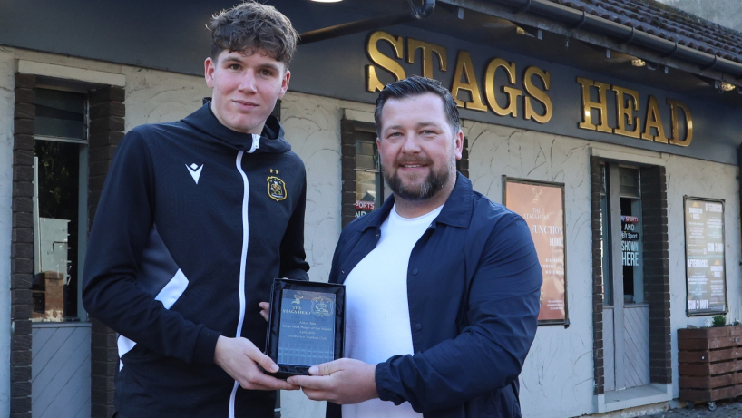 Aidan Rice is presented with the Stags Head Player of the Month award by Jamie Moses of Dumbarton FC