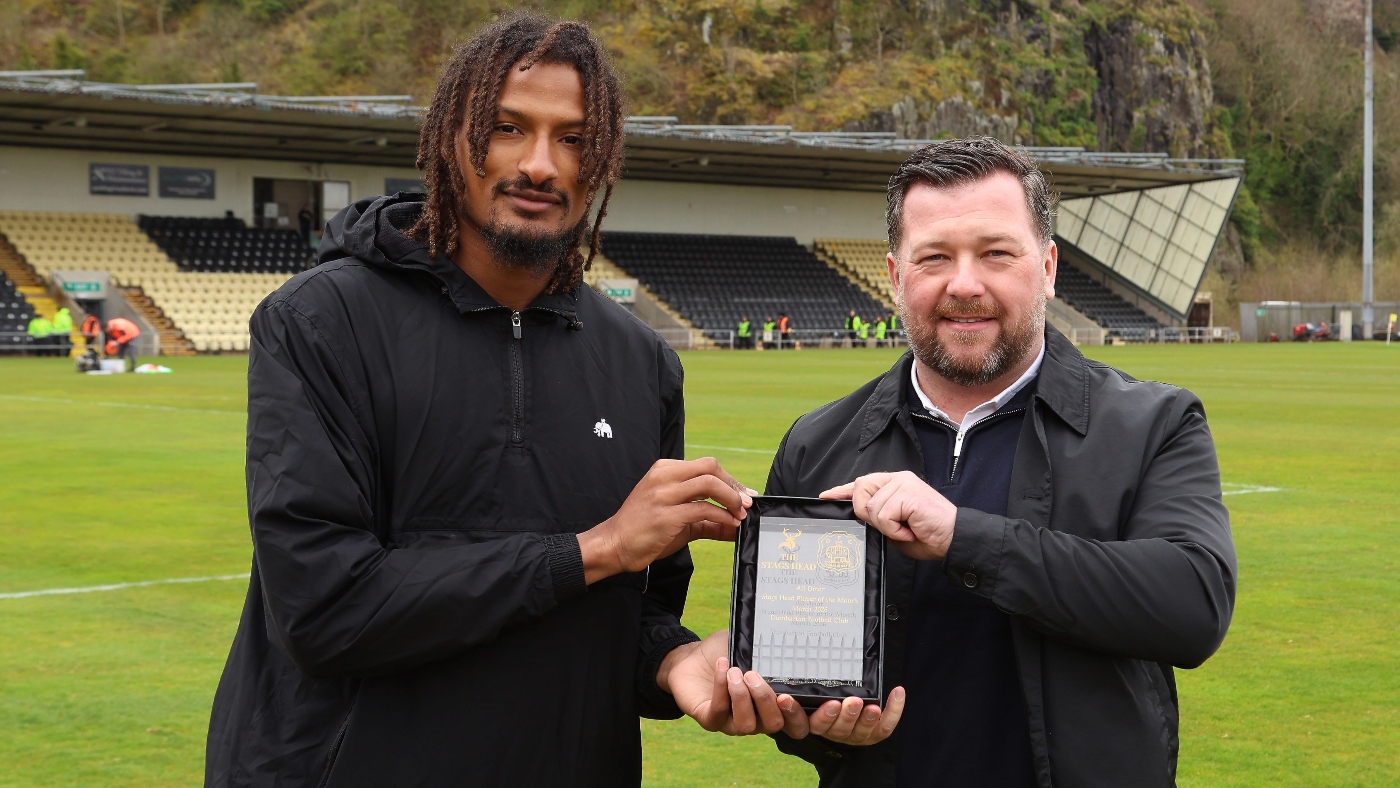 Ali Omar of Dumbarton FC receives his Stags Head Player of the Month award from Jamie Moses