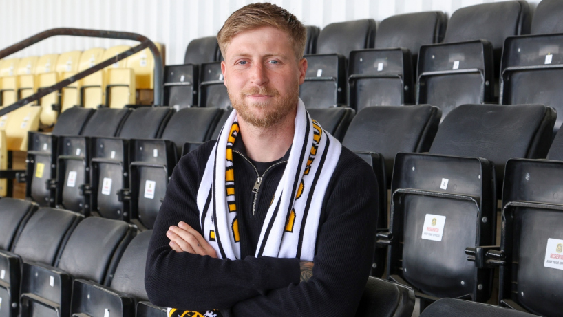 Tommy Robson signing for Dumbarton