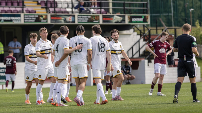 Dumbarton FC players celebrate in a game against Kelty Hearts