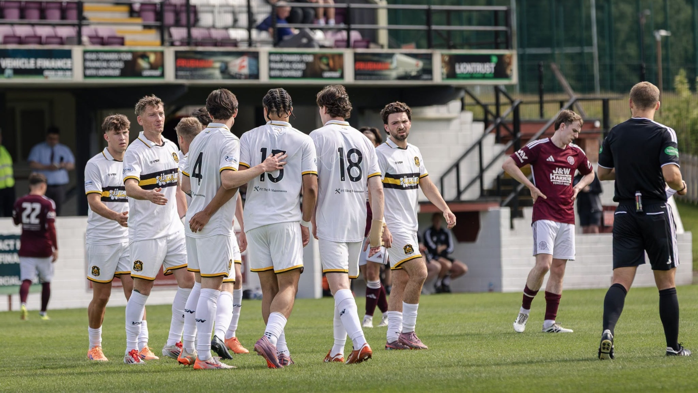 Dumbarton FC players celebrate in a game against Kelty Hearts