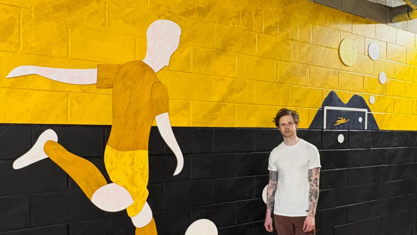 Lewis Deeney artist with mural at Dumbarton FC
